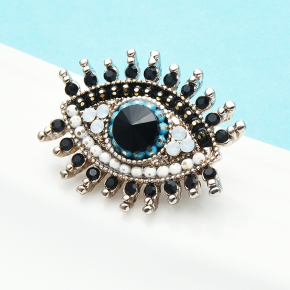 Jewelry - Goldtone CZ Eye Brooch pin ribbon